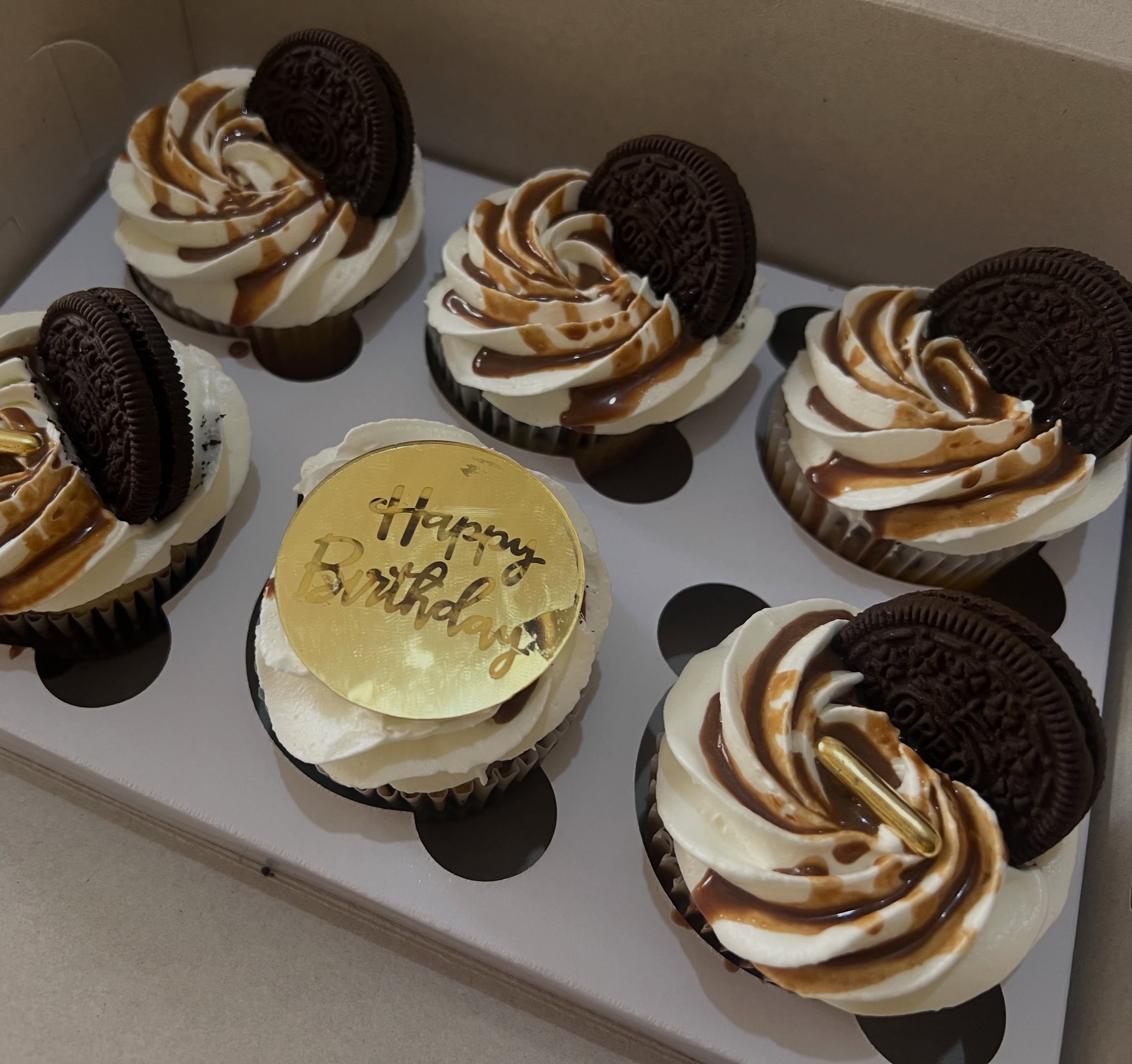 Box of chocolate and caramel Oreo cupcakes